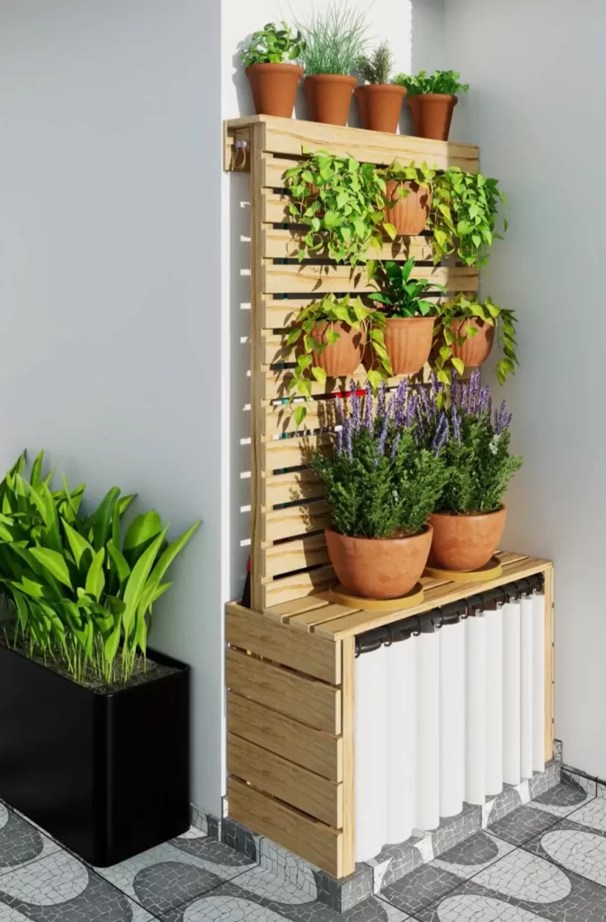 Canto para esconder botijões e vassouras finalizado, decorado com vasos de plantas e cortina.