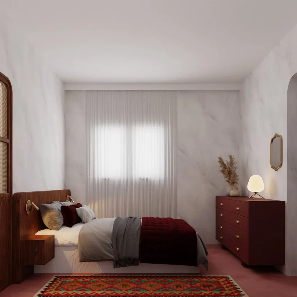 Quarto aconchegante com manta de tricô marrom escuro, cortinas brancas gelo e cômoda de madeira.