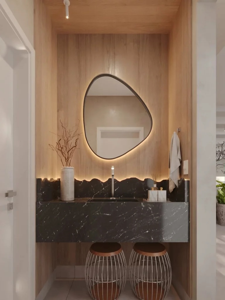 Espelho com fita de led no banheiro e pia com design diferente.