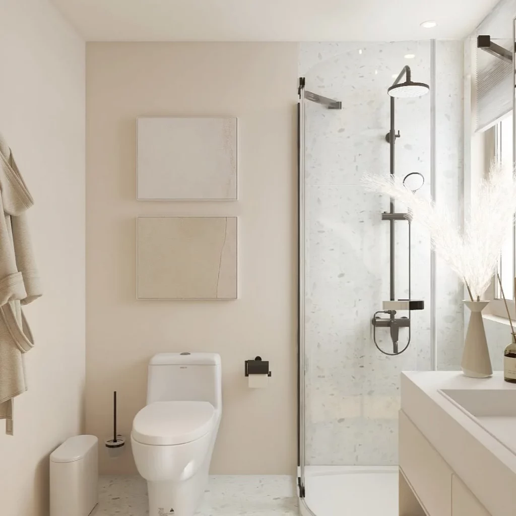 Banheiro minimalista com quadros.