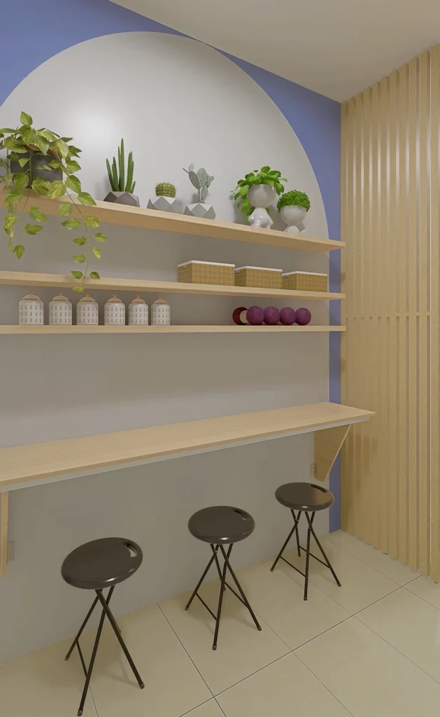Canto de trabalho com pintura setorizada azul, mesa de madeira, banquetas, vasos de plantas, prateleiras e cestos organizadores.
