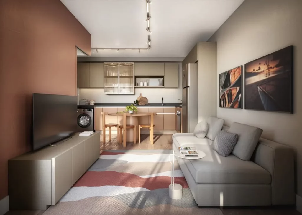 Cozinha e sala conjugada com tapete estampado, armário neutro e soffá neutro.