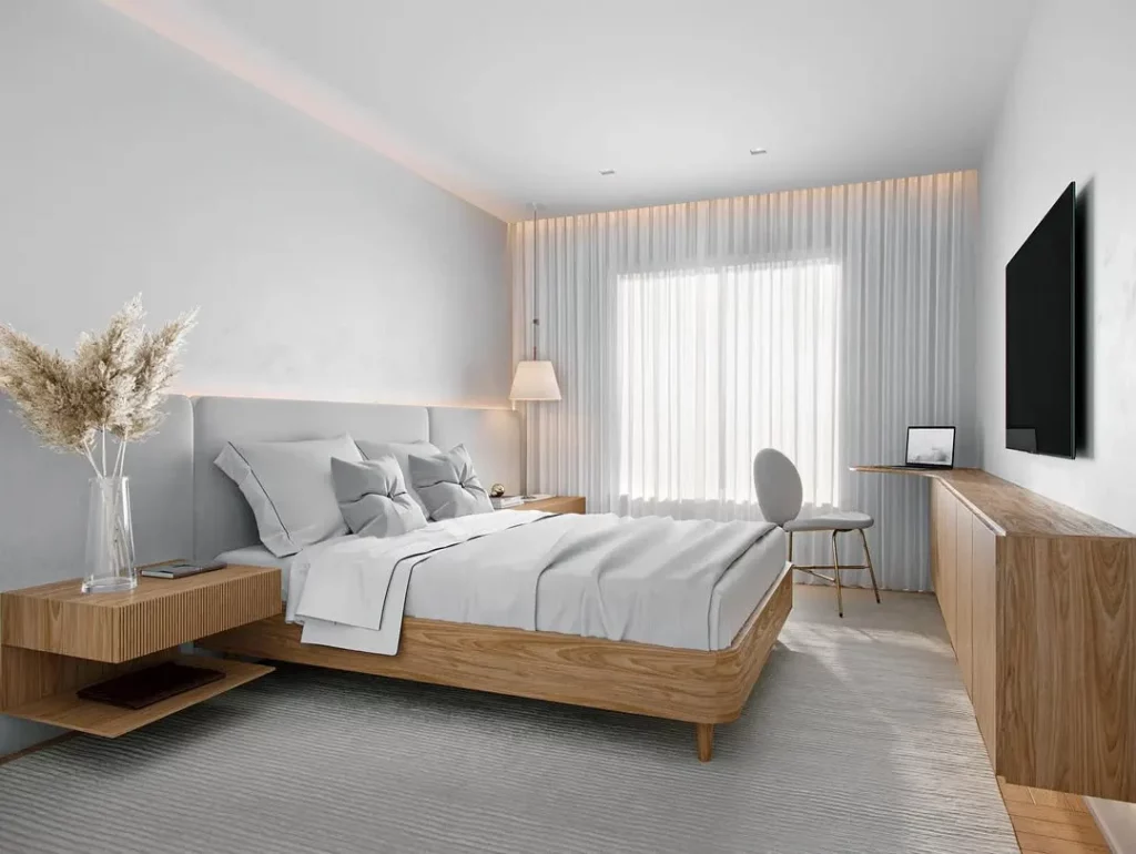 Quarto minimalista com flores secas e em tons de cinza.