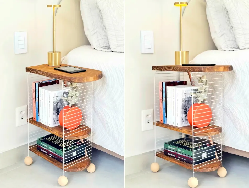 Mesa de cabeceira com kindle, livros e vaso decorativo, luminária dourada em cima.